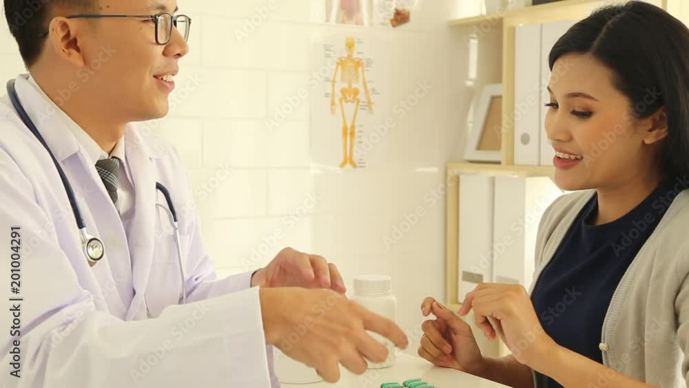 Asian male doctor Patient examination Woman in hospital Asian male doctor Patient examination Woman in hospital