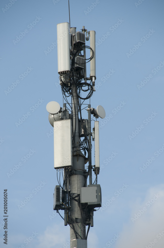 Cell tower closeup against a white sky. Cell tower closeup against a white sky.