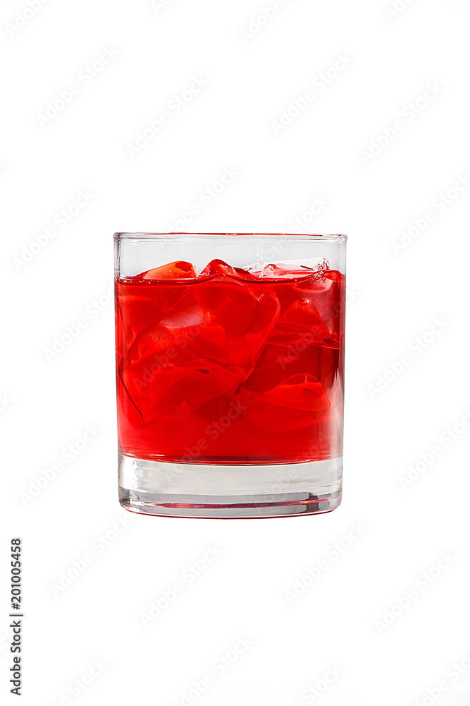 A single-colored transparent cocktail, refreshing in a low glass with ice cubes and taste of berries, cherries, strawberries, greiprut. Side view. Isolated white background. Drink for the menu A single-colored transparent cocktail, refreshing in a low glass with ice cubes and taste of berries, cherries, strawberries, greiprut. Side view. Isolated white background. Drink for the menu