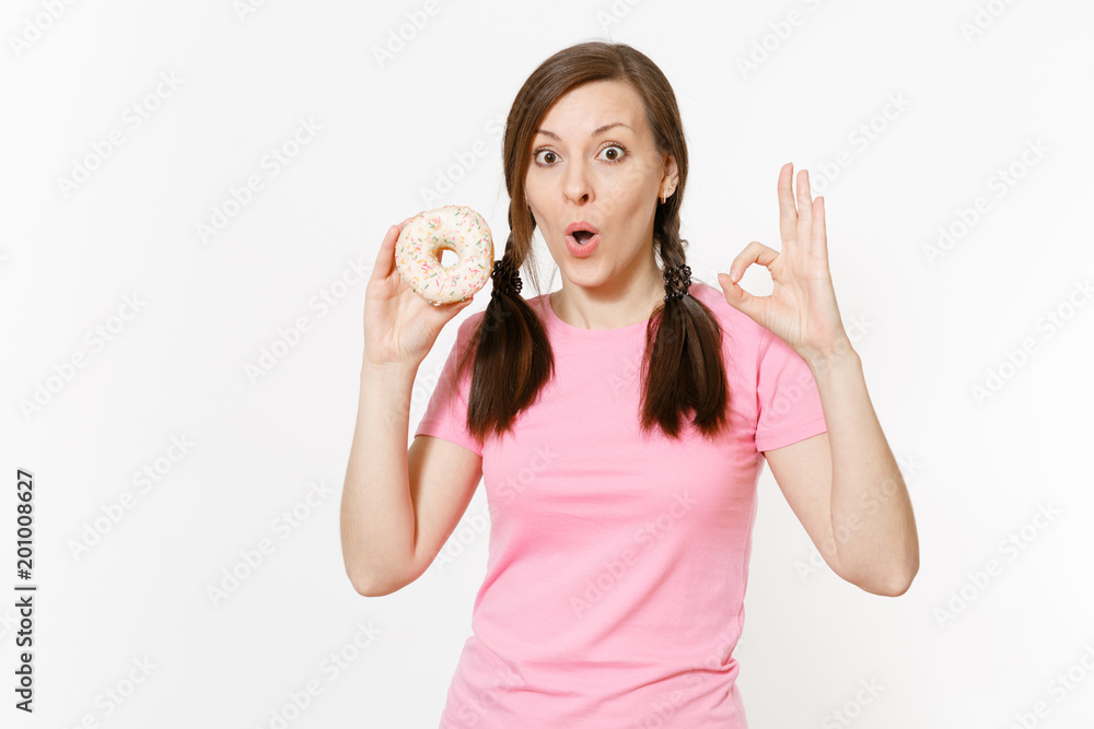 Beautiful fun happy woman holding in hands colorful donut isolated on white background. Proper nutrition or sweets, dessert fast food. dieting concept. Copy space for advertisement. Advertising area. Beautiful fun happy woman holding in hands colorful donut isolated on white background. Proper nutrition or sweets, dessert fast food. dieting concept. Copy space for advertisement. Advertising area.