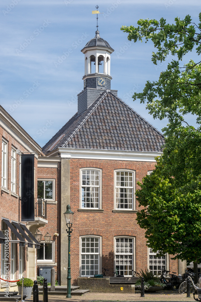 Building with tower at the 'Kerkplein' (Church Square) in the city of Ootmarsum, NLD