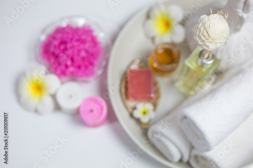 Beautiful composition of spa treatment on white wooden table