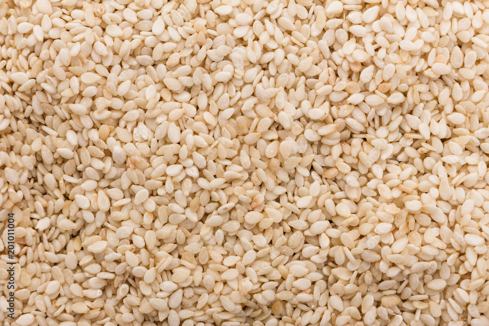 fresh sesame seeds on a rustic background fresh sesame seeds on a rustic background