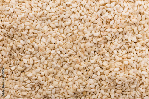 fresh sesame seeds on a rustic background
