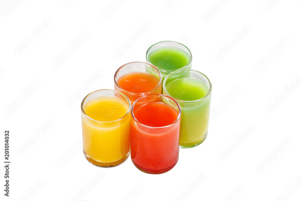 Multicolored opaque cocktails, a set of shots a handful, five servings, with a taste of fruits, vegetables, orange, carrots, greens. Side view from above Isolated white background. Drink for the menu Multicolored opaque cocktails, a set of shots a handful, five servings, with a taste of fruits, vegetables, orange, carrots, greens. Side view from above Isolated white background. Drink for the menu