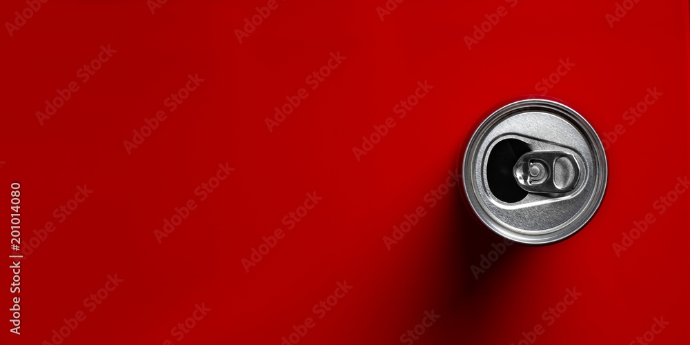Open drink can directly above on red background. Panoramic image with copy space. Open drink can directly above on red background. Panoramic image with copy space.