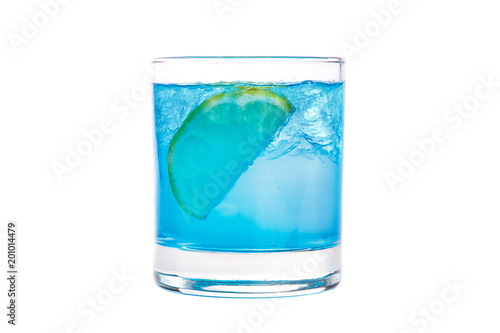A single-colored transparent cocktail, refreshing shining in a low blue glass with crushed ice frappe and semicircle of a slice of lemon. Side view Isolated white background. Drink for the menu