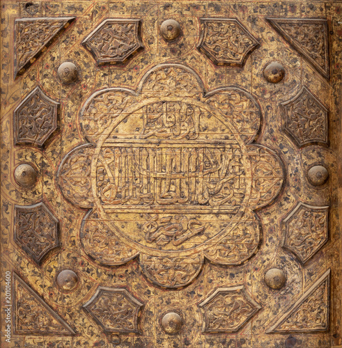 Wooden carved epigraphic blazon, part of wooden ceiling, Azhar Mosque, Cairo, Egypt photo