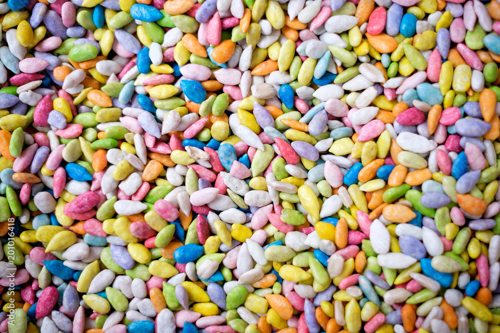 food, junk-food, confectionery and unhealthy eating concept - close up of multicolored dragee candies food, junk-food, confectionery and unhealthy eating concept - close up of multicolored dragee candies