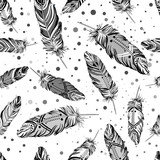 Hand drawn vector seamless pattern with painted bird feathers. Titled background. Black and white art for your design. Trendy boho style patterned elements, sketch