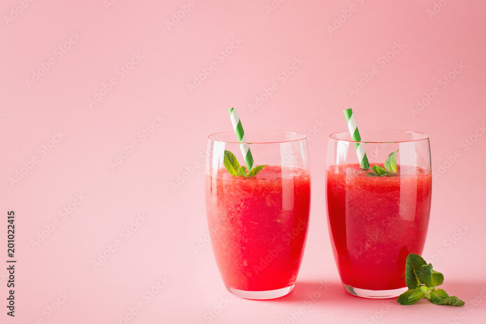 Watermelon smoothie with slice of fruit and leaf of mint Watermelon smoothie with slice of fruit and leaf of mint