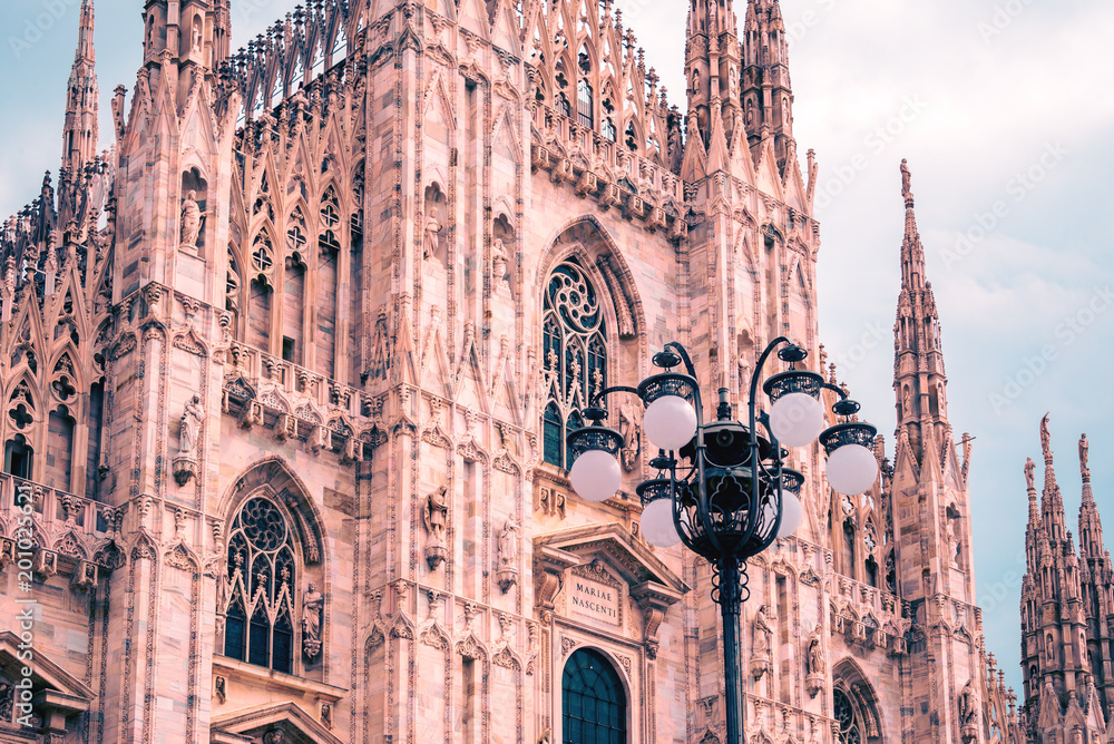 Naklejka premium Exterior architecture of Milan Cathedral, known as Duomo di Milano, one of the largest churches in the world.