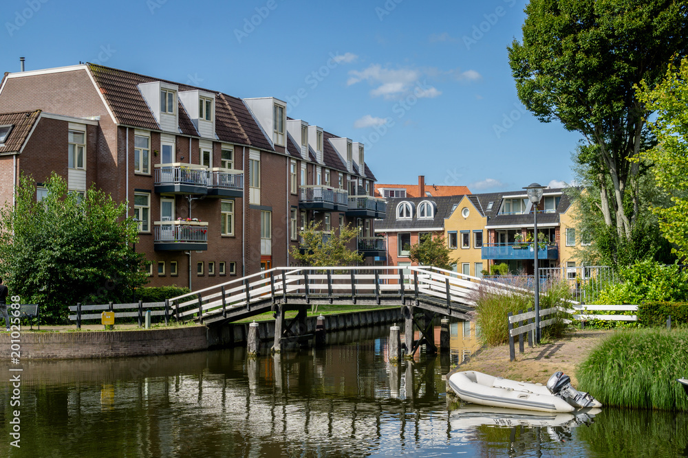 Cityscape of Sneek at Looxmagracht (Looxma canal) and Zwarteweg at  Badhuisgracht (Badhuis canal) and Prins Hendrikkade in the province Friesland, The Netherlands