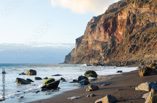 Black sand beach at the atlantic ocean in La Gomera, one of the canary islands.