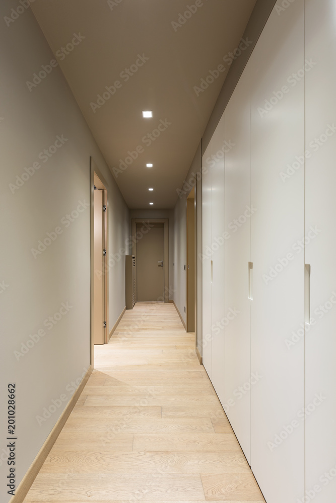 Corridor with white wardrobe. Interior of modern apartment Corridor with white wardrobe. Interior of modern apartment