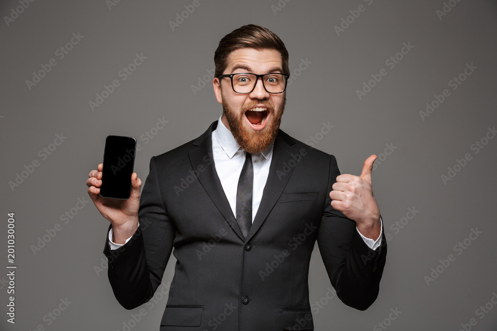 Portrait of a happy young businessman dressed in suit Portrait of a happy young businessman dressed in suit