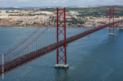 Top view of 25 de Abril Bridge in Lisbon over Tagus river