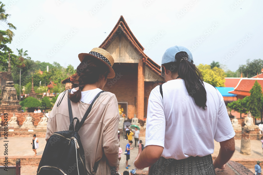 Two young teenager friends travel in the history place