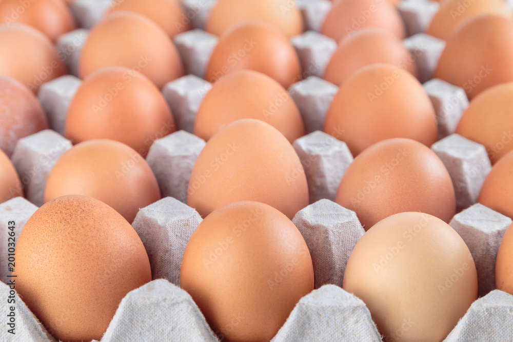 Chicken eggs are fresh in a cardboard package made of recycled waste paper. Chicken eggs are fresh in a cardboard package made of recycled waste paper.
