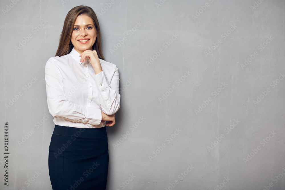Thinking business woman portrait on gray wall Thinking business woman portrait on gray wall