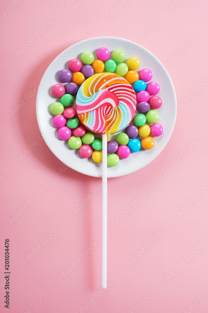 Colorful chocolate candies and lollipop Colorful chocolate candies and lollipop