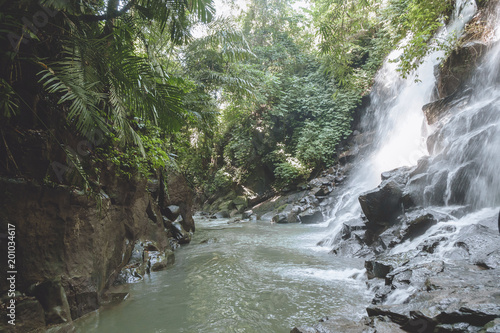 Fotografija scenic view of beautiful Kanto Lampo Waterfall, green plants and rocks, Bali, In
