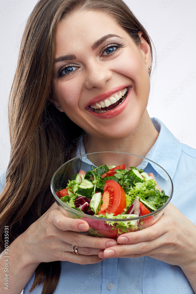 Smiling woman holding glass bowl with vegetable salad. Smiling woman holding glass bowl with vegetable salad.