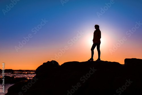 Woman on top a of the rock