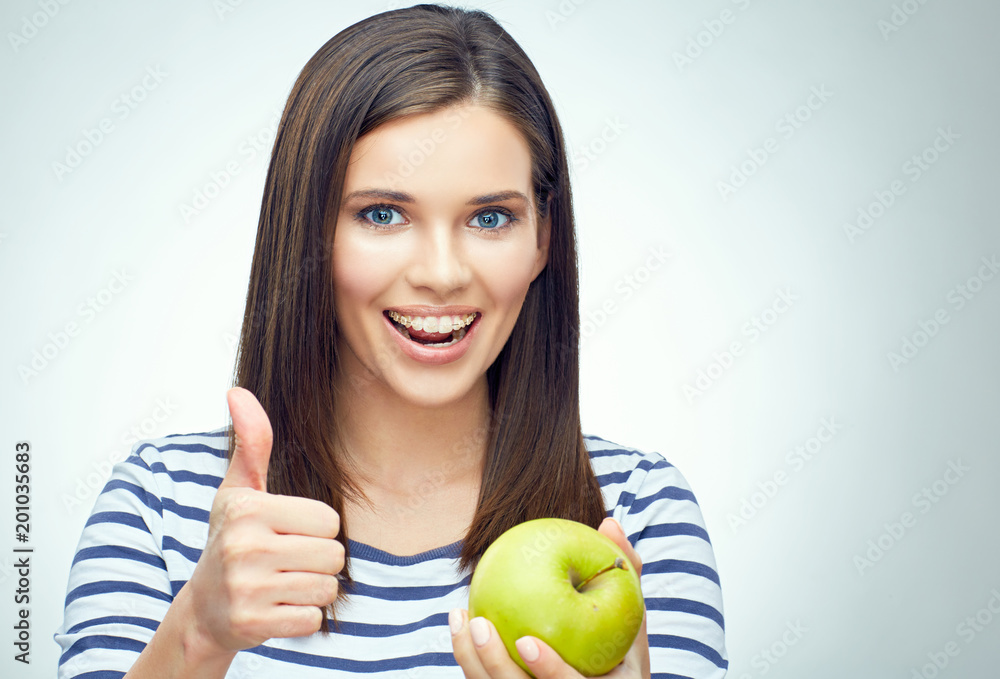 Face portrait of smiling teenager girl with dental braces holdin Face portrait of smiling teenager girl with dental braces holdin