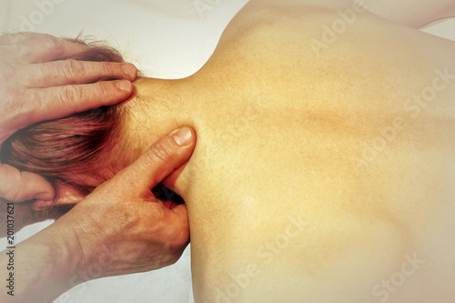 massage of the female neck  the hands of the masseur men  vignette