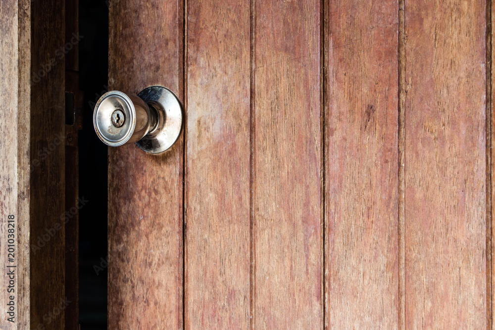 Old wooden door was ajar and a stainless steel door knob disintegrated. Old wooden door was ajar and a stainless steel door knob disintegrated.