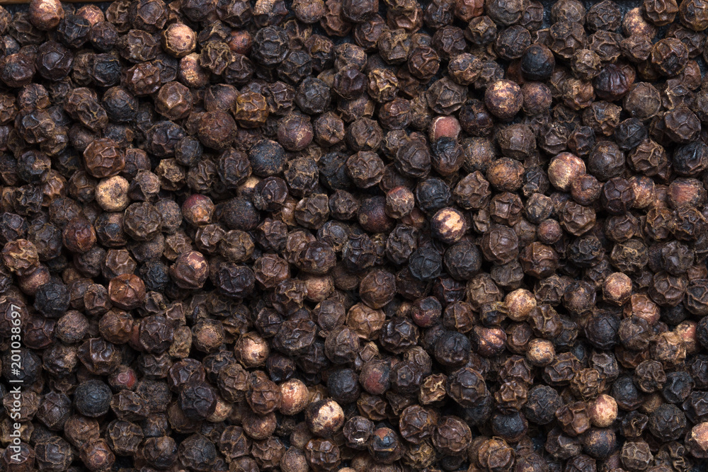Black dry peppercorn background. Macro photography. Black dry peppercorn background. Macro photography.