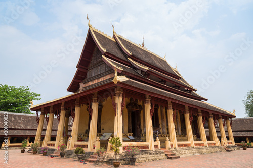 View of the Buddhist Wat Si Saket (Sisaket) temple in Vientiane, Laos, on a sunny day.