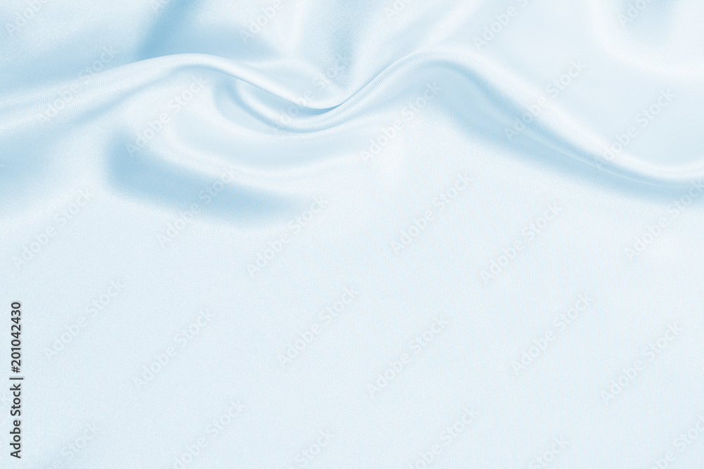 Naklejka premium Smooth elegant blue silk or satin luxury cloth texture as abstract background. Luxurious background design