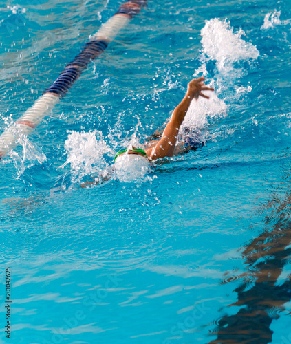 boy on a swim in a sports pool