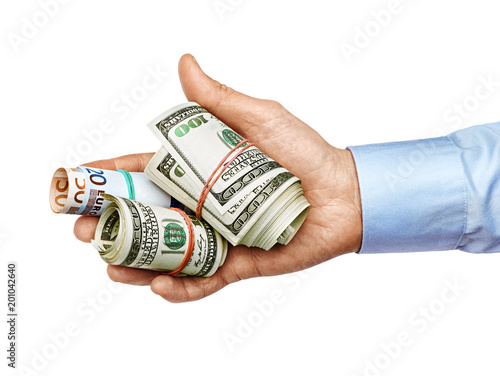Man's hand in shirt holding dollars banknotes isolated on white background. High resolution product. Close up