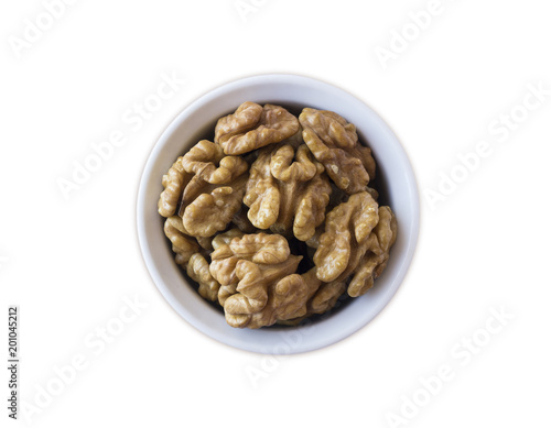 Kernels walnuts isolated on white. Walnuts in a bowl isolated on white background. Top view. Walnuts with copy space for text on a white background
