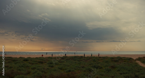 Barcelona, Spain - February 19, 2014: people enjoying the beach a winter day in Castelldefels