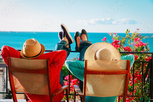 happy couple relax on balcony terrace