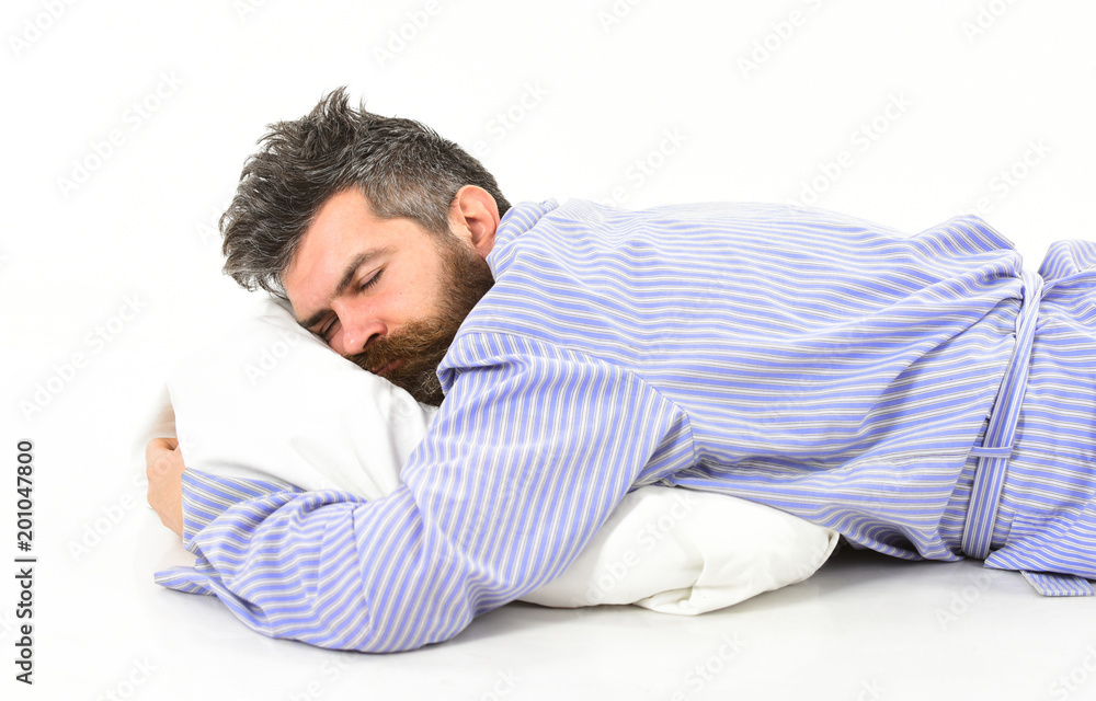 young handsome bearded man in bathrobe sleeping on pillow young handsome bearded man in bathrobe sleeping on pillow