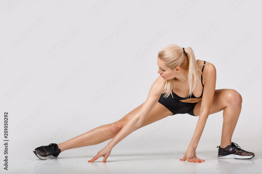 woman in sportswear does exercises woman in sportswear does exercises