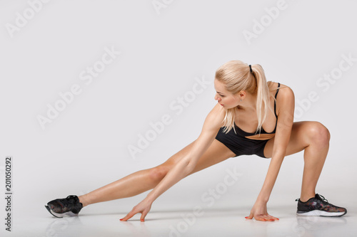 woman in sportswear does exercises