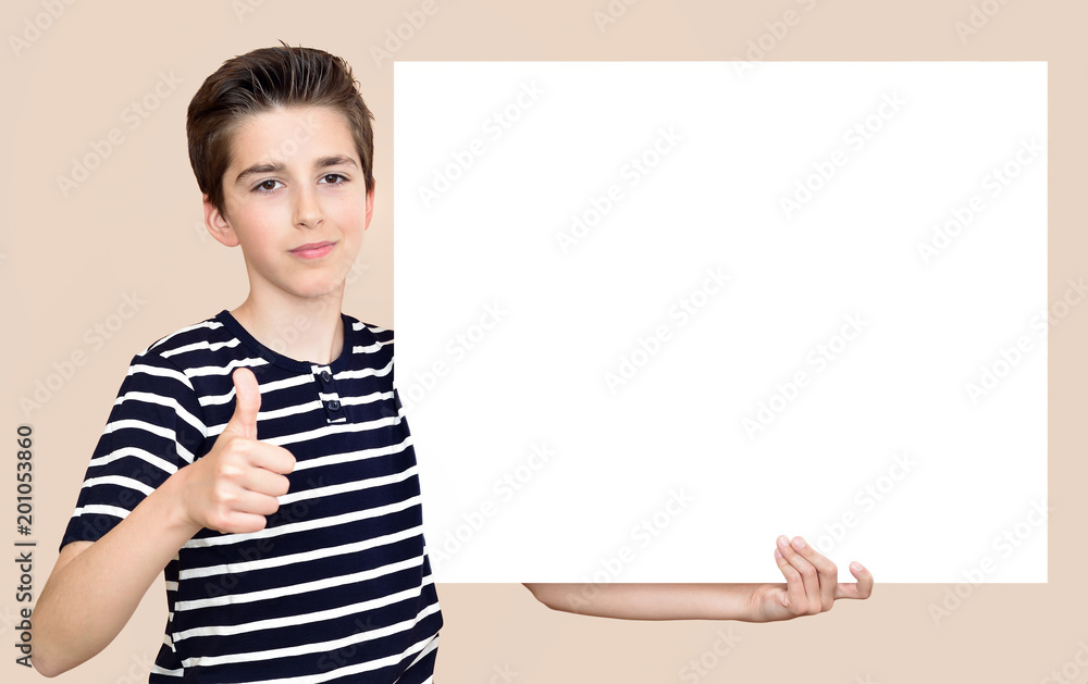 Young boy with thumb up holding blank white board Young boy with thumb up holding blank white board