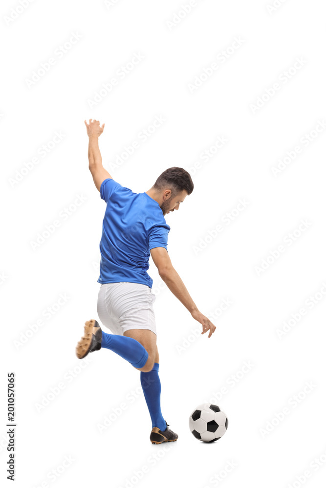 Fototapeta premium Soccer player kicking a football