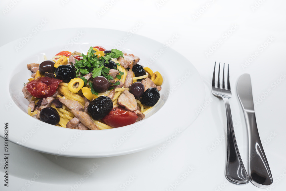 Spaghetti with Mediterranean tuna, capers, olives, Sicilian chilli pepper, cherry tomatoes and a sprinkling of parsley Spaghetti with Mediterranean tuna, capers, olives, Sicilian chilli pepper, cherry tomatoes and a sprinkling of parsley