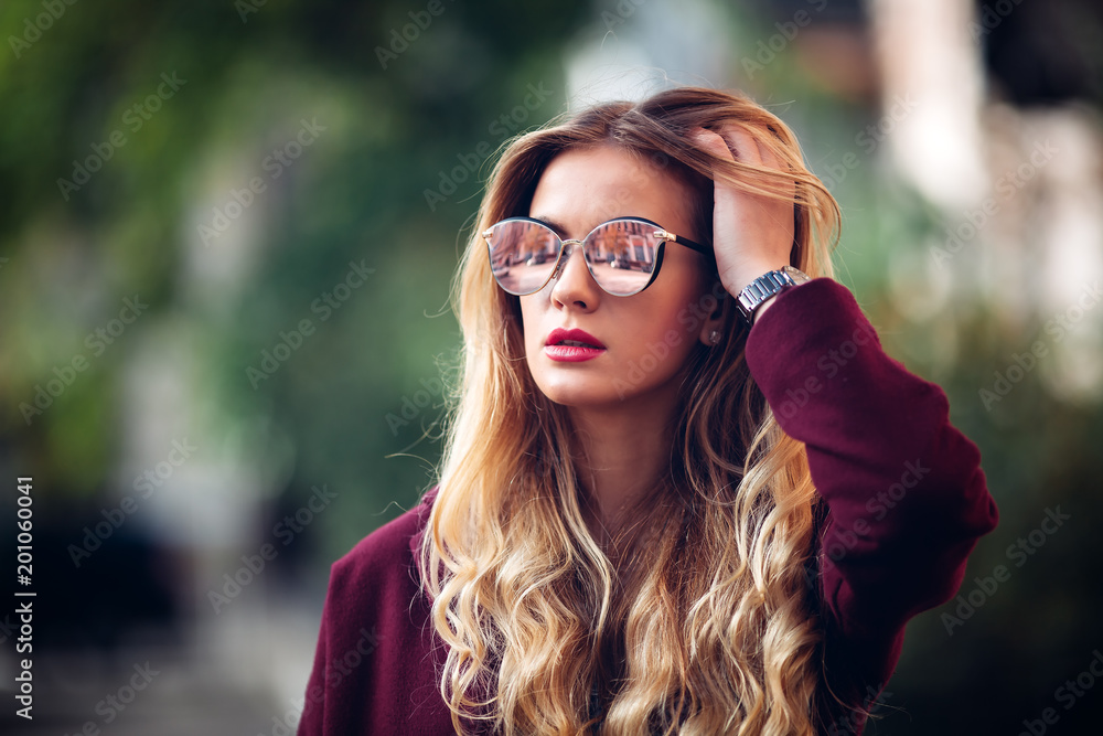 Close up fashion street stile portrait of pretty girl in fall casual outfit Beautiful blond posing outdoor. Close up fashion street stile portrait of pretty girl in fall casual outfit Beautiful blond posing outdoor.