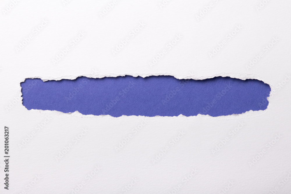 Ripped white paper with colored background with space for text Ripped white paper with colored background with space for text
