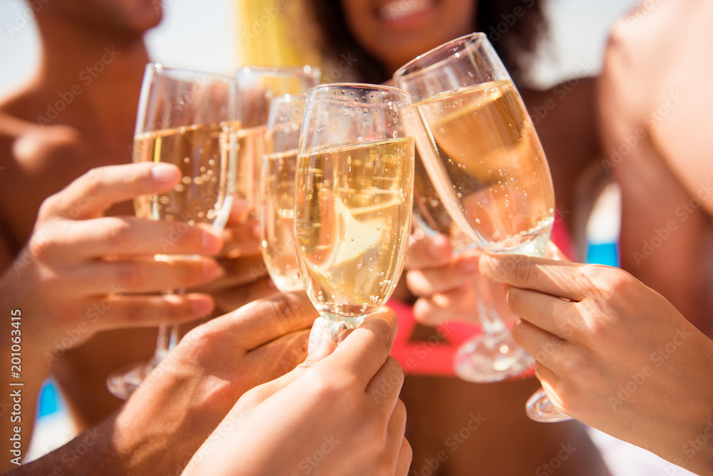 Diversity international entertainment season festive event cheerful joyful smiling victory win tourism travel concept. Close up cropped photo of people's hands clinking glasses full of champagne Diversity international entertainment season festive event cheerful joyful smiling victory win tourism travel concept. Close up cropped photo of people's hands clinking glasses full of champagne