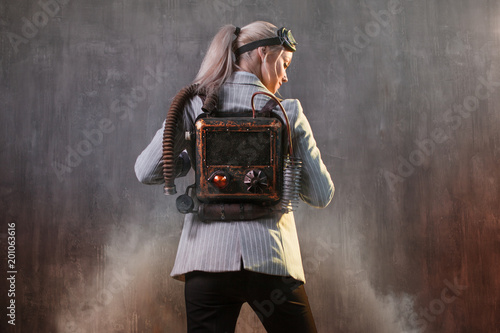 Young woman businesswoman with jetpack on the back. Business acceleration concept, startup, technology and development photo