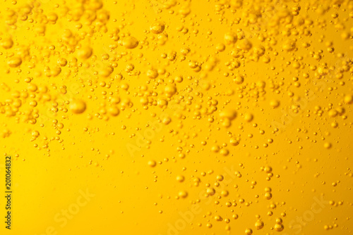 Motion of bubble oil liquid or beer juice syrup yellow color for background